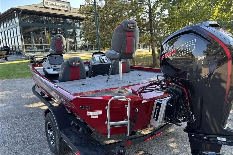 Slide: The Image of 2024 Ranger RT188P boat with Mercury Pro XS engine, parked outdoors. - 7
