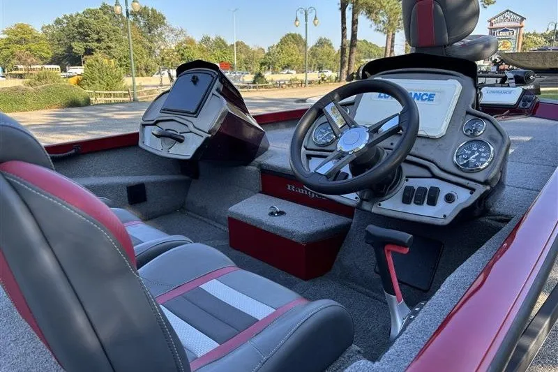 Slide: The Image of 2024 Ranger RT188P boat interior with steering wheel and dashboard controls. - 13