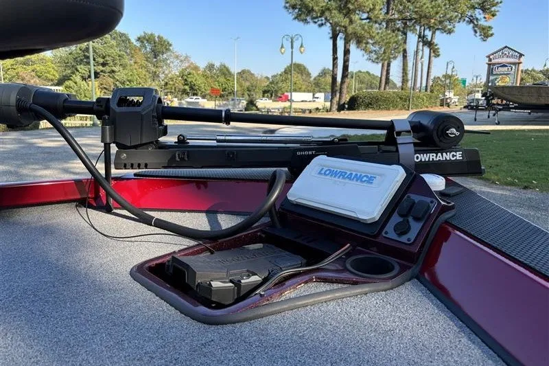 Slide: The Image of 2024 Ranger RT188P boat with Lowrance electronics and trolling motor, parked outdoors. - 9