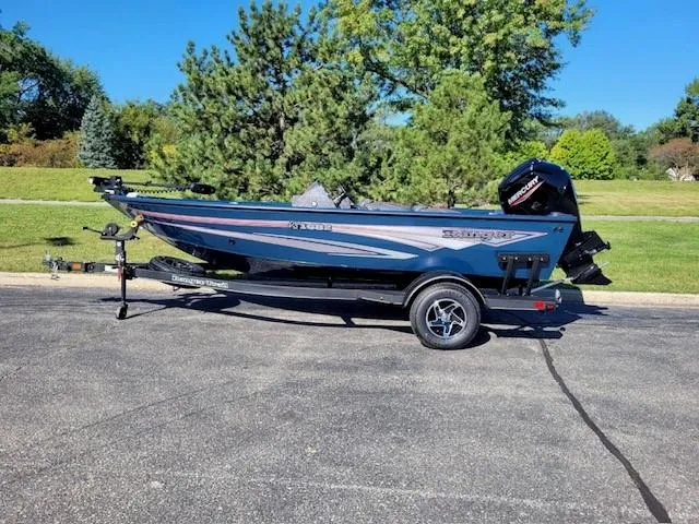 Slide: The Image of 2024 Ranger VS1682SC Angler boat on trailer, parked outdoors. - 0