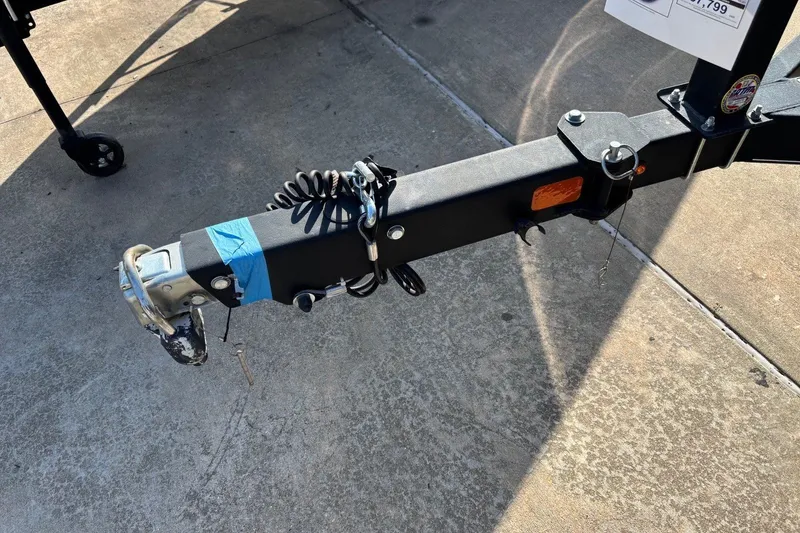 Slide: The Image of Trailer hitch of a 2024 Tahoe 185 S on concrete surface. - 10