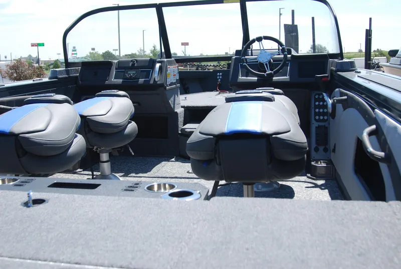 Slide: The Image of 2024 Ranger VX1988 WT boat, spacious interior, dual seating, outboard motor, ladder, and windshield. - 2