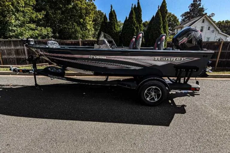 The Image of 2024 Ranger VS1682SC Angler boat parked on a residential street. - 0