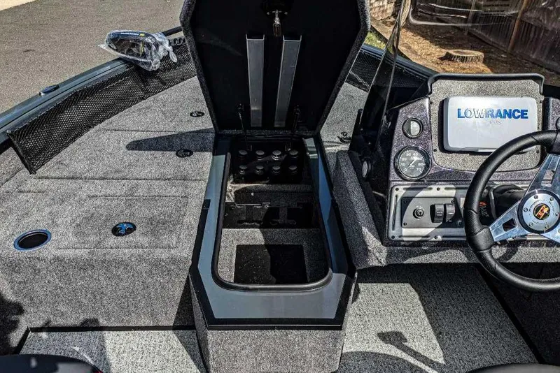 Slide: The Image of 2024 Ranger VS1682SC Angler boat interior with storage and navigation system. - 2