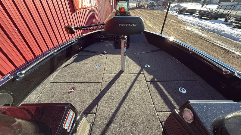 Slide: The Image of 2024 Nitro ZV20 boat interior with carpeted deck and seating. - 5