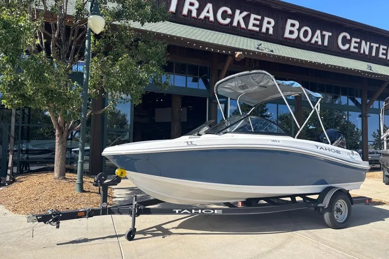 Slide: The Image of 2024 Tahoe 185 S boat on trailer outside Tracker Boat Center. - 1