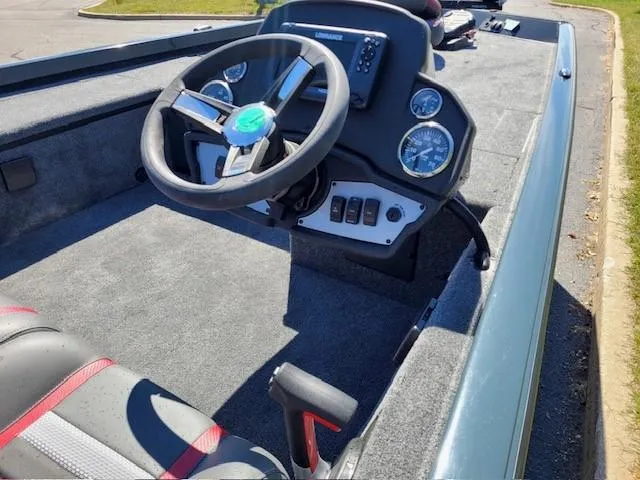 Slide: The Image of 2024 Ranger RT188C boat cockpit with steering wheel and dashboard controls. - 3