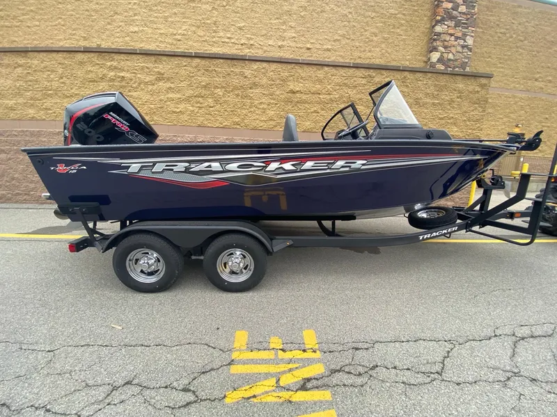 The Image of 2024 Tracker Targa V-18 WT boat on trailer, parked outdoors. - 0
