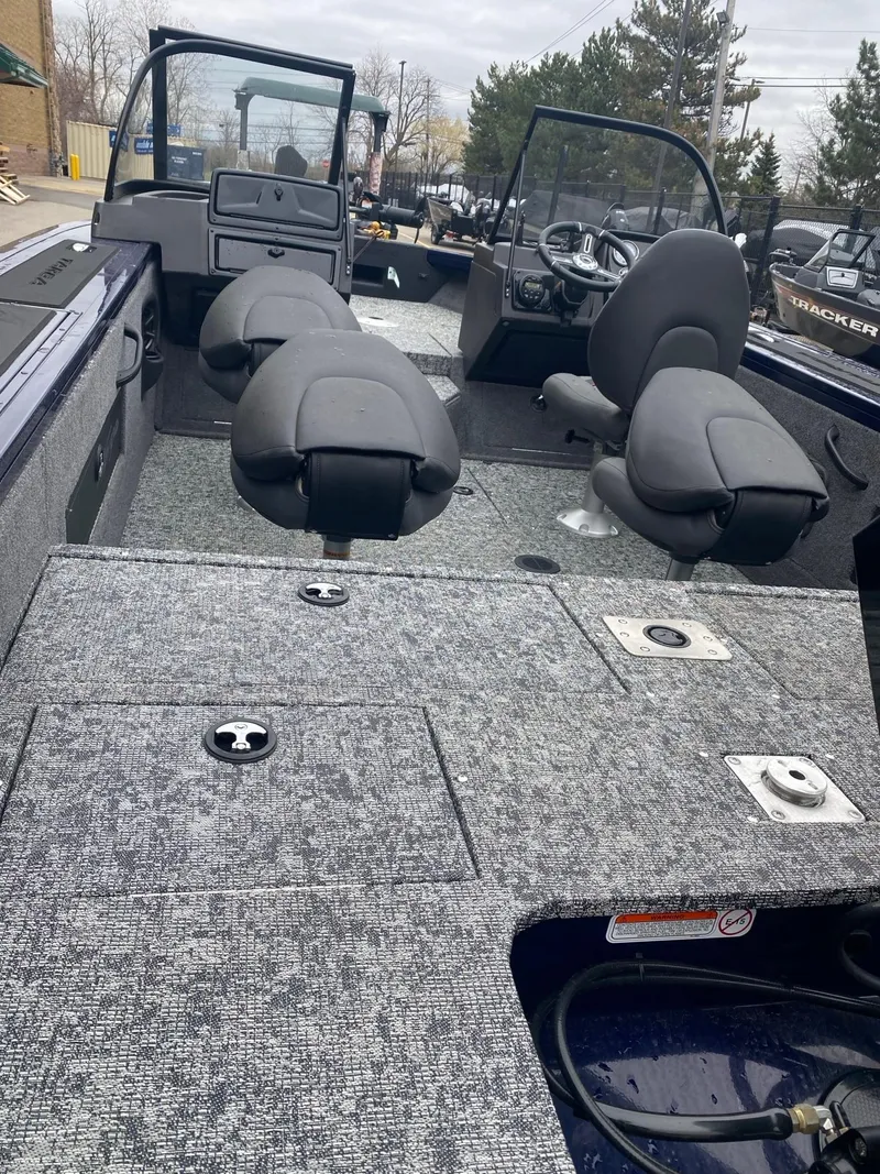 Slide: The Image of 2024 Tracker Targa V-18 WT boat interior with seating and storage compartments. - 4