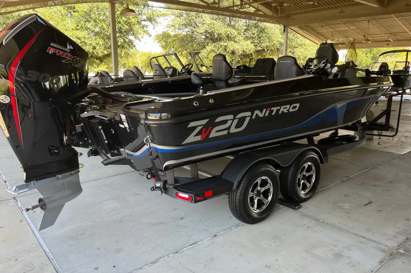 Slide: The Image of 2024 Nitro ZV20 boat with Mercury Pro XS engine on a trailer. - 1