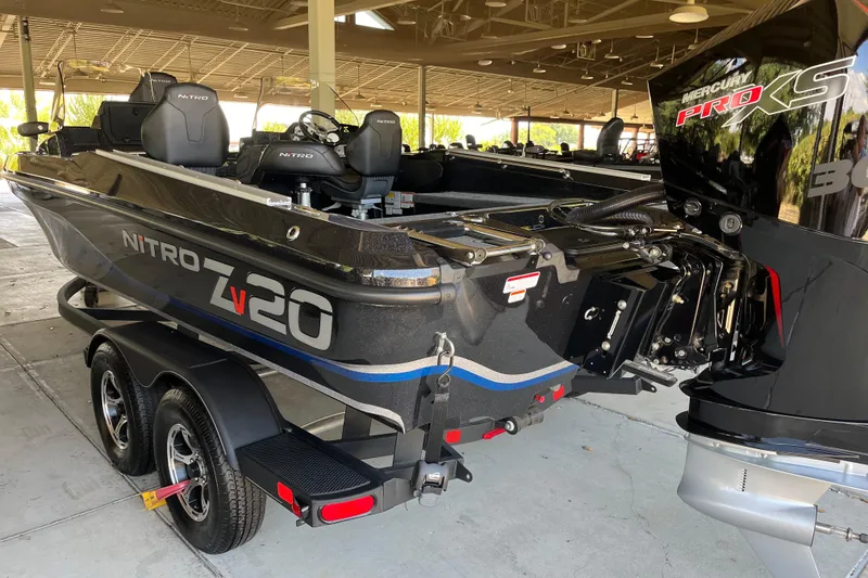 Slide: The Image of 2024 Nitro ZV20 boat with Mercury Pro XS engine, displayed on a trailer. - 2