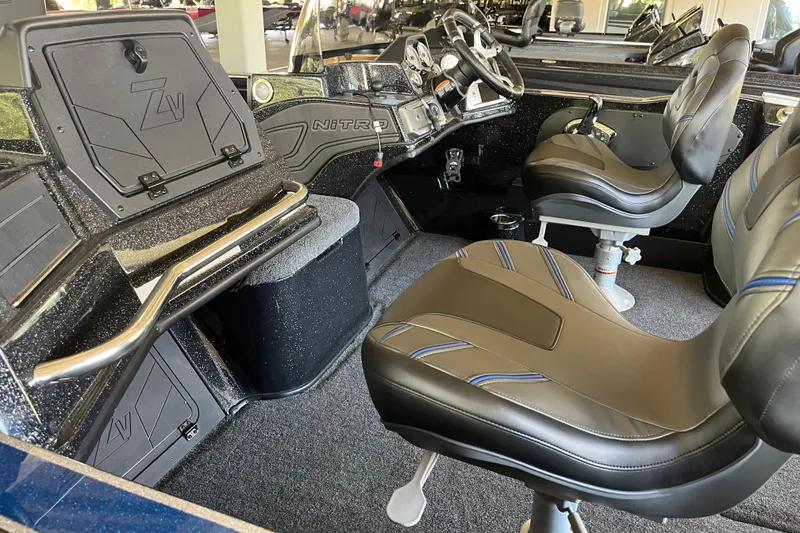 Slide: The Image of 2024 Nitro ZV20 boat interior with sleek seating and modern dashboard design. - 5