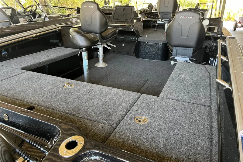 Slide: The Image of 2024 Nitro ZV20 boat interior with spacious seating and carpeted deck. - 7