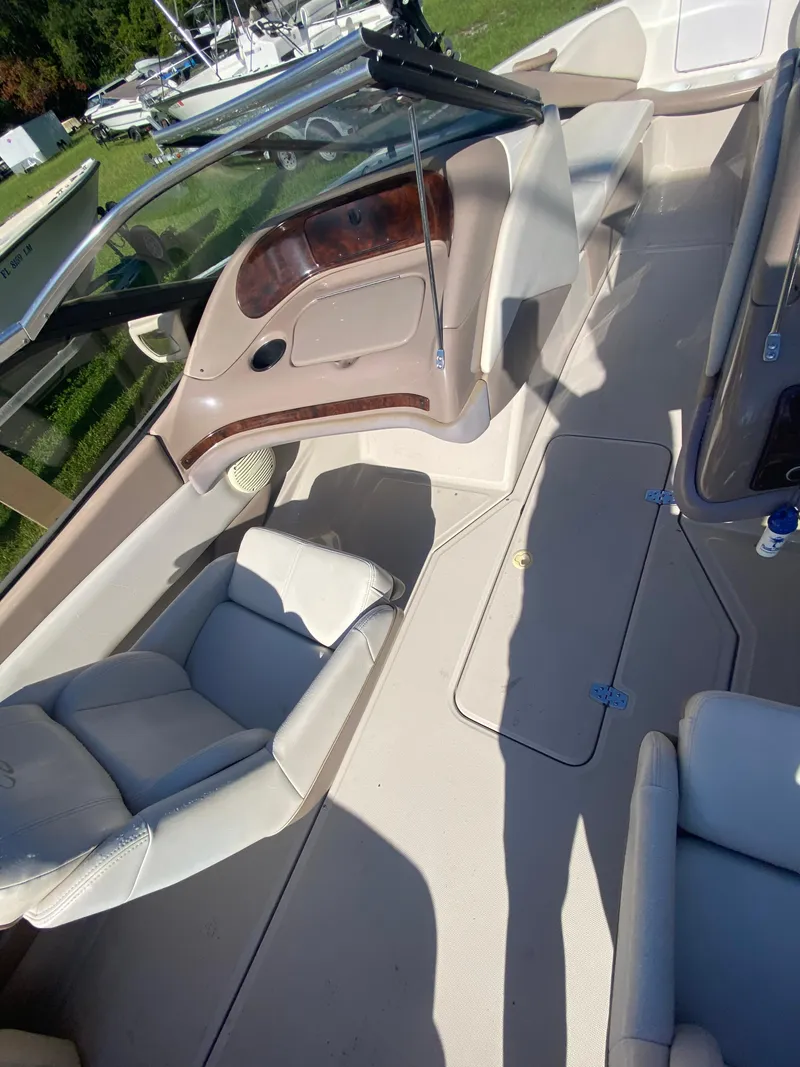 Slide: The Image of 2002 Regal 1900 LSR boat interior with beige seating and dashboard. - 5