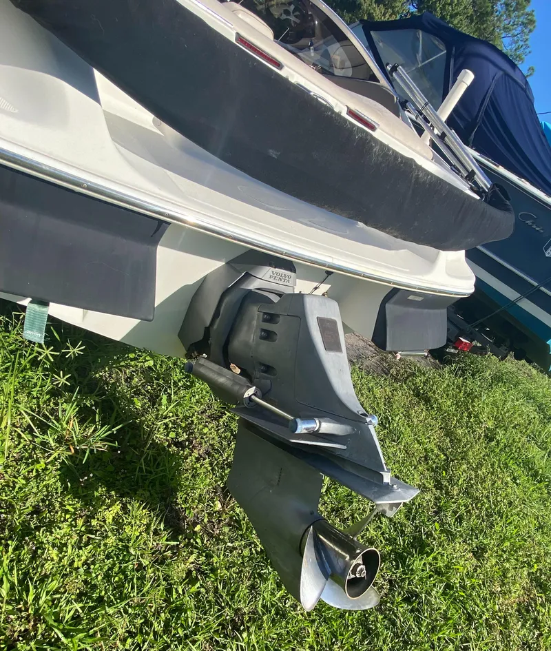 Slide: The Image of 2002 Regal 1900 LSR boat stern and propeller on grass. - 6