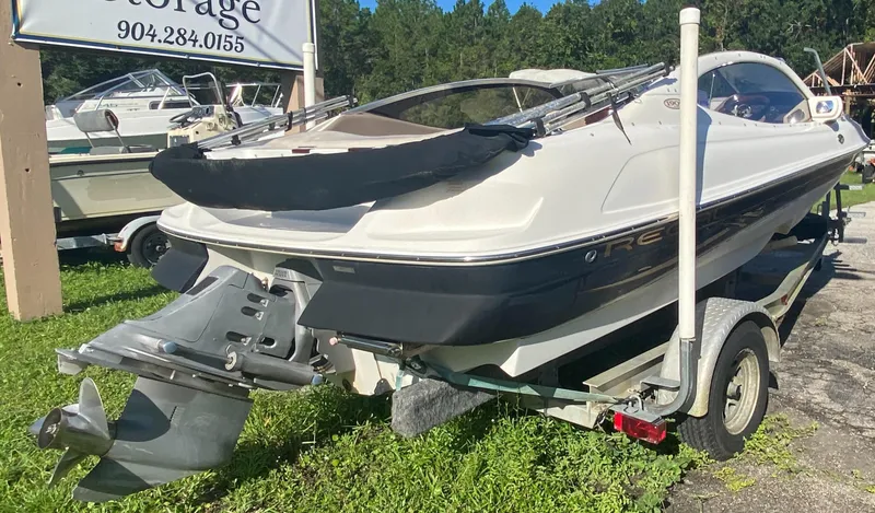 Slide: The Image of 2002 Regal 1900 LSR boat on trailer, parked outdoors, rear view. - 7