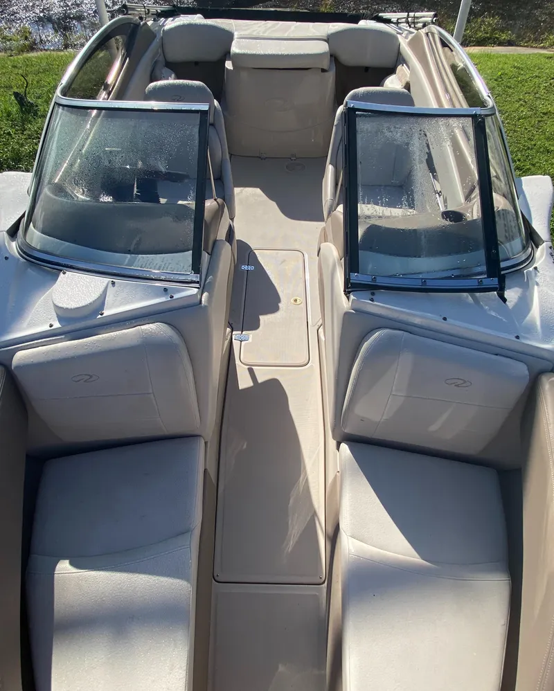 Slide: The Image of 2002 Regal 1900 LSR boat interior with beige seating and dual windshields. - 9