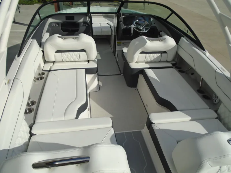 Slide: The Image of Luxurious 2025 Regal LX2 boat interior with white seating and modern design. - 12