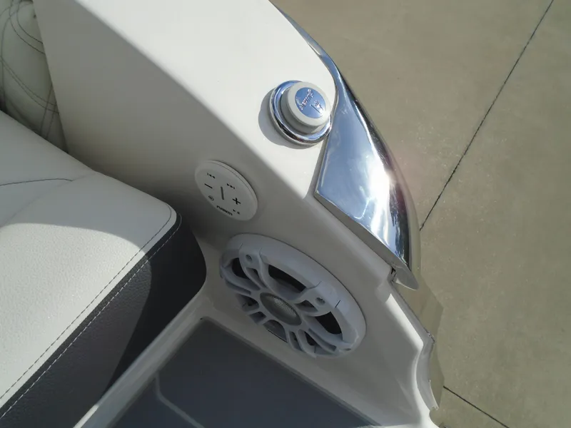 Slide: The Image of 2025 Regal LX2 boat interior with speaker and control panel. - 16