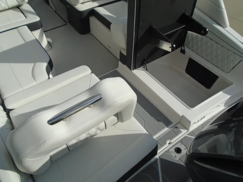 Slide: The Image of Luxurious interior of 2025 Regal LX2 boat with white seating and modern design. - 18