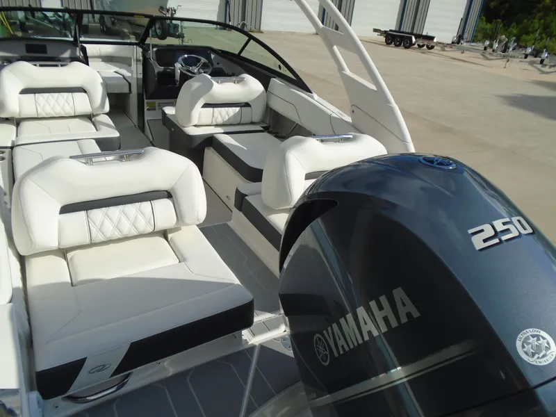 Slide: The Image of 2025 Regal LX2 boat interior with Yamaha 250 engine, featuring luxurious white seating. - 20