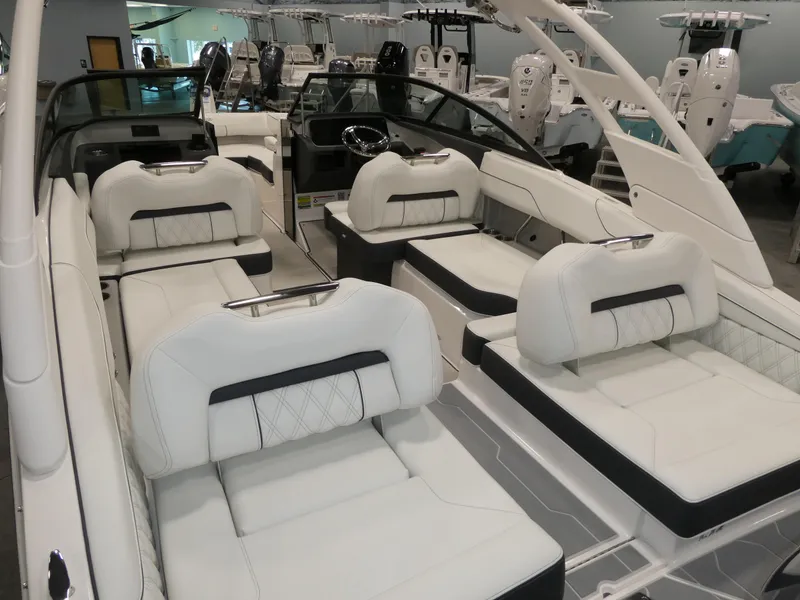 Slide: The Image of Luxurious interior of 2025 Regal LX2 boat with plush white seating and modern design. - 23
