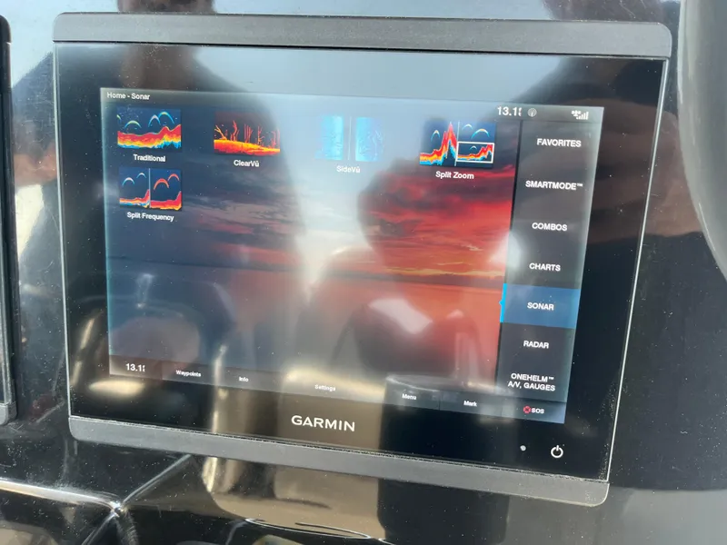 Slide: The Image of Garmin marine display on 2019 Wellcraft 262 Fisherman, showing sonar and navigation options. - 19