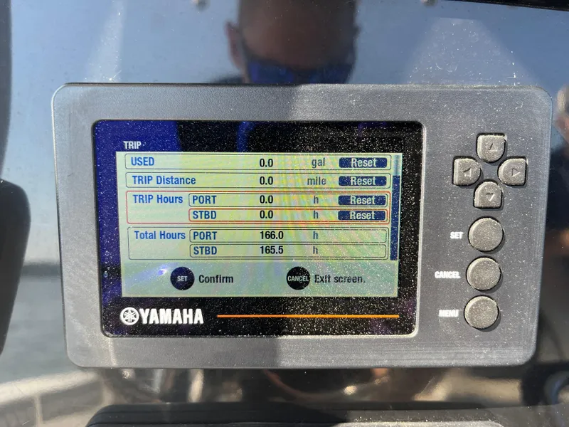 Slide: The Image of Yamaha display on 2019 Wellcraft 262 Fisherman showing trip and total engine hours. - 20