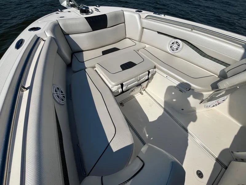 Slide: The Image of 2019 Wellcraft 262 Fisherman boat interior with cushioned seating and speaker system. - 30