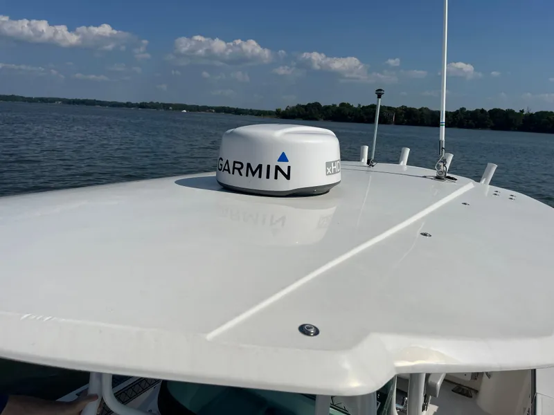Slide: The Image of 2019 Wellcraft 262 Fisherman boat with Garmin radar on calm water. - 37