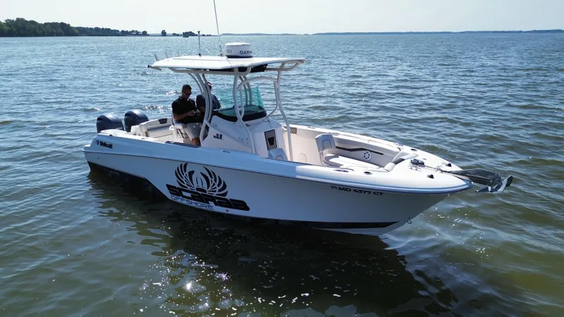 Slide: The Image of 2019 Wellcraft 262 Fisherman boat on calm water, featuring a sleek design and modern equipment. - 4