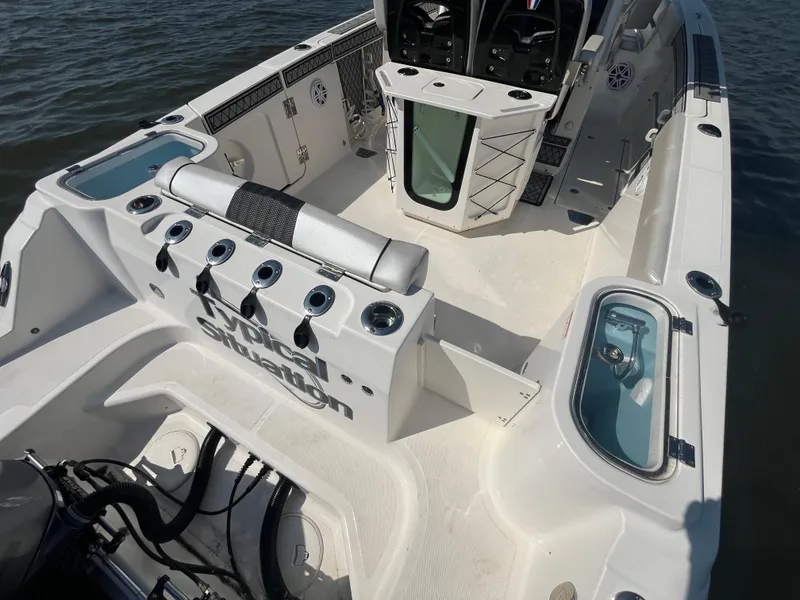 Slide: The Image of 2019 Wellcraft 262 Fisherman boat interior with rod holders and storage compartments. - 8