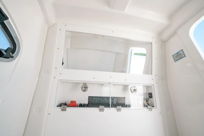 Slide: The Image of 2023 Caymas 341 CC interior cabin with control panel and window. - 10
