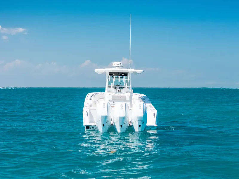 Slide: The Image of 2023 Caymas 341 CC boat on clear blue ocean water. - 20