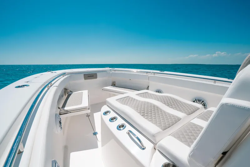 Slide: The Image of 2023 Caymas 341 CC boat interior with luxurious seating and ocean view. - 8