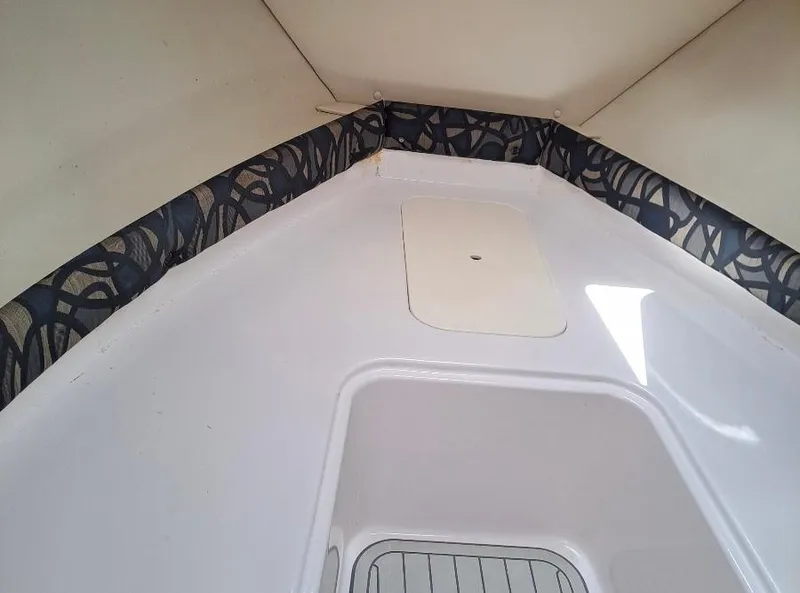 Slide: The Image of 2011 Pro-Line 23 Express cabin interior with patterned trim and white finish. - 10