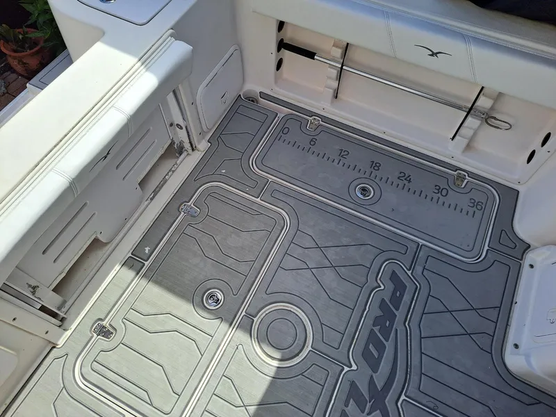 Slide: The Image of 2011 Pro-Line 23 Express boat deck with custom non-slip flooring and built-in measuring guide. - 7