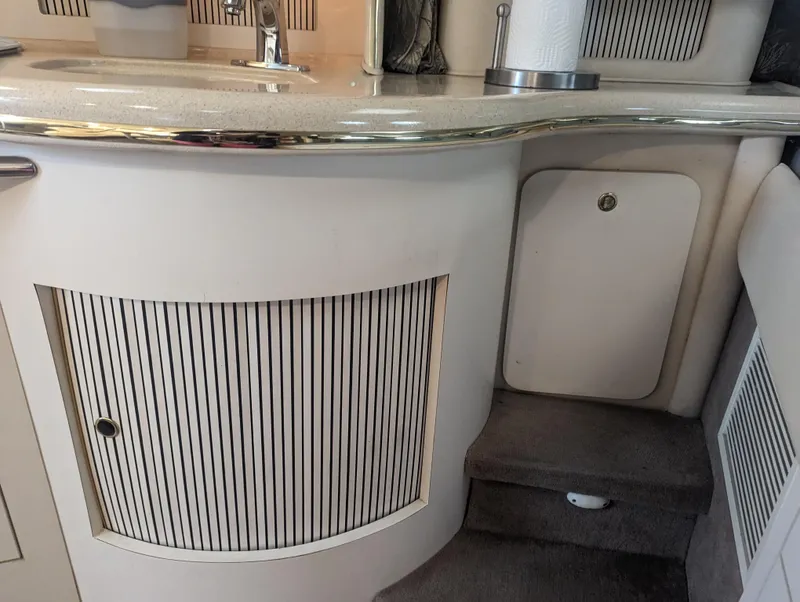 Slide: The Image of Interior of 2000 Sea Ray 310 Sundancer yacht with sleek cabinetry and countertop. - 10