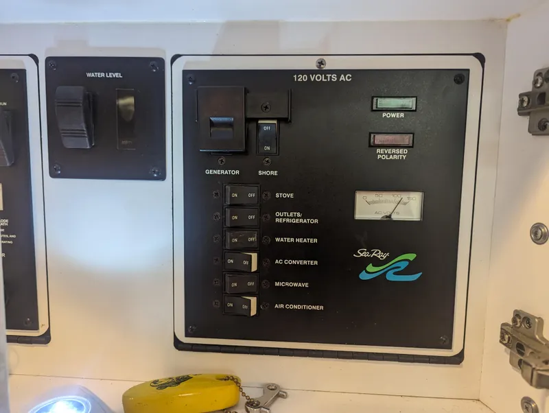 Slide: The Image of Electrical control panel of 2000 Sea Ray 310 Sundancer boat. - 17