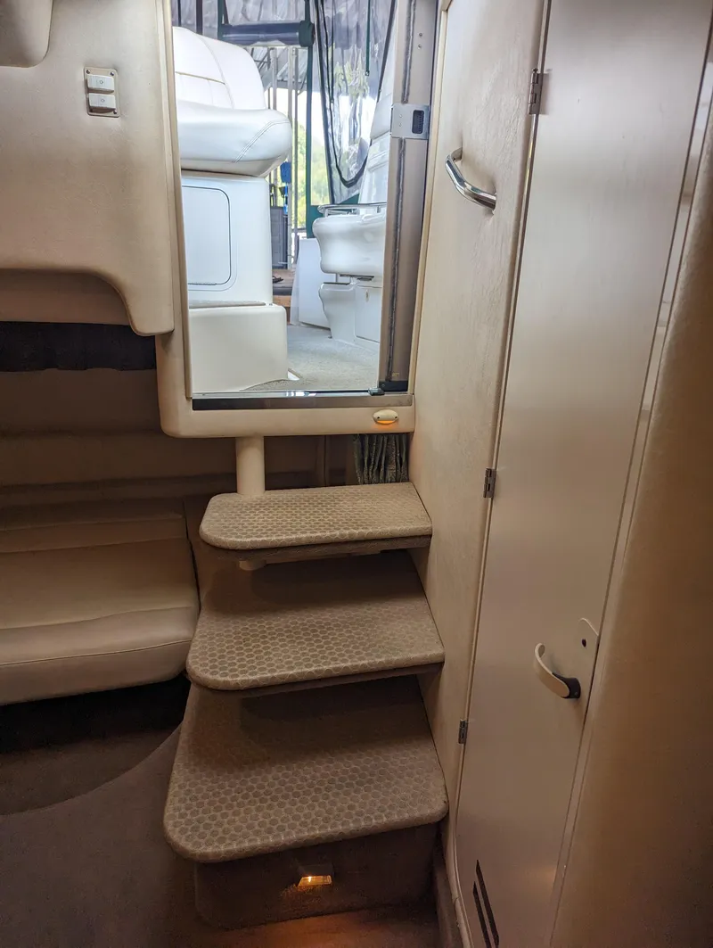 Slide: The Image of Interior stairs of 2000 Sea Ray 310 Sundancer yacht, leading to cockpit area. - 23