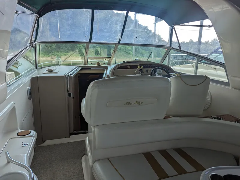 Slide: The Image of Interior of 2000 Sea Ray 310 Sundancer boat with helm and seating area. - 30