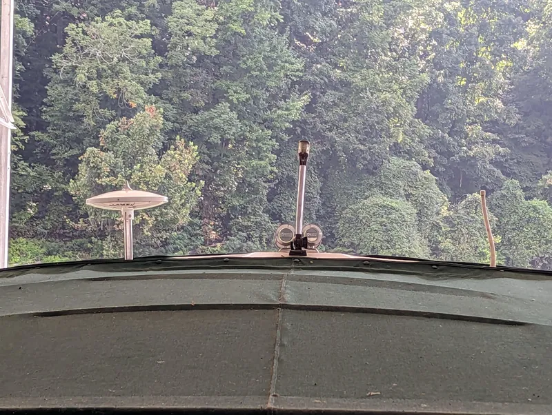 Slide: The Image of View from a 2000 Sea Ray 310 Sundancer boat, overlooking lush green trees. - 42