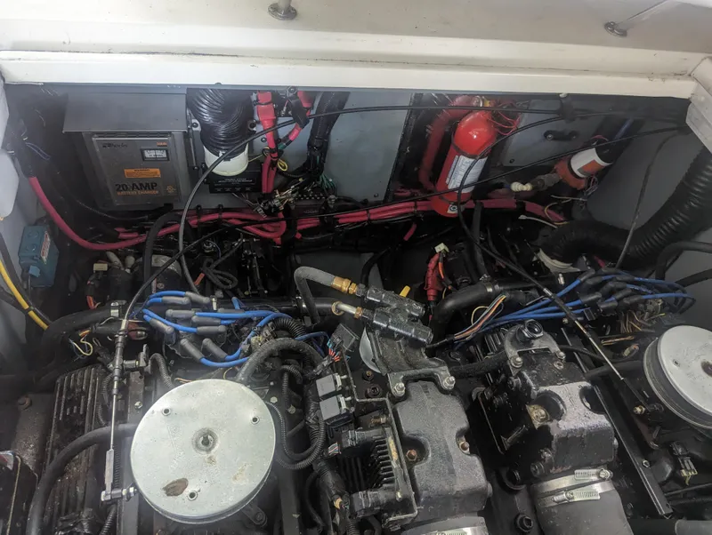Slide: The Image of Engine compartment of 2000 Sea Ray 310 Sundancer with visible wiring and components. - 43