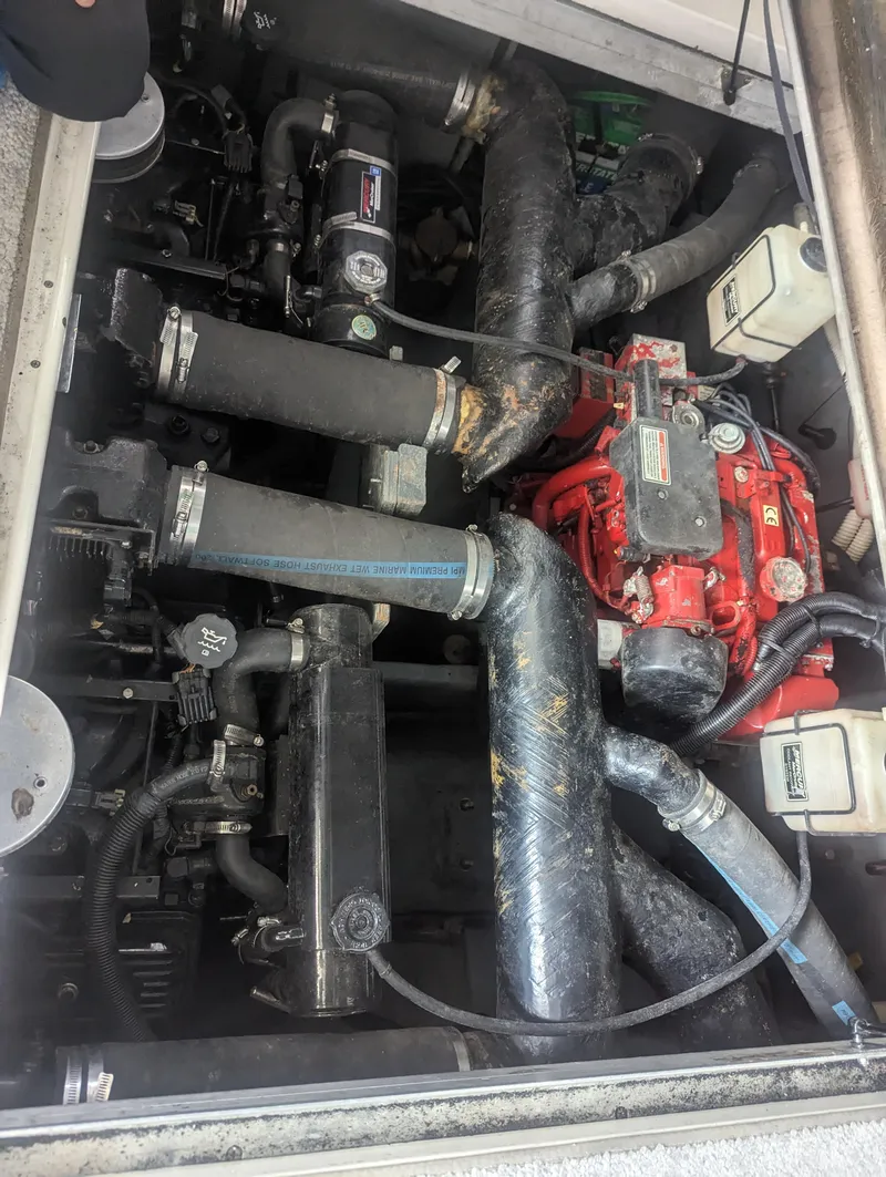 Slide: The Image of Engine compartment of a 2000 Sea Ray 310 Sundancer boat. - 44