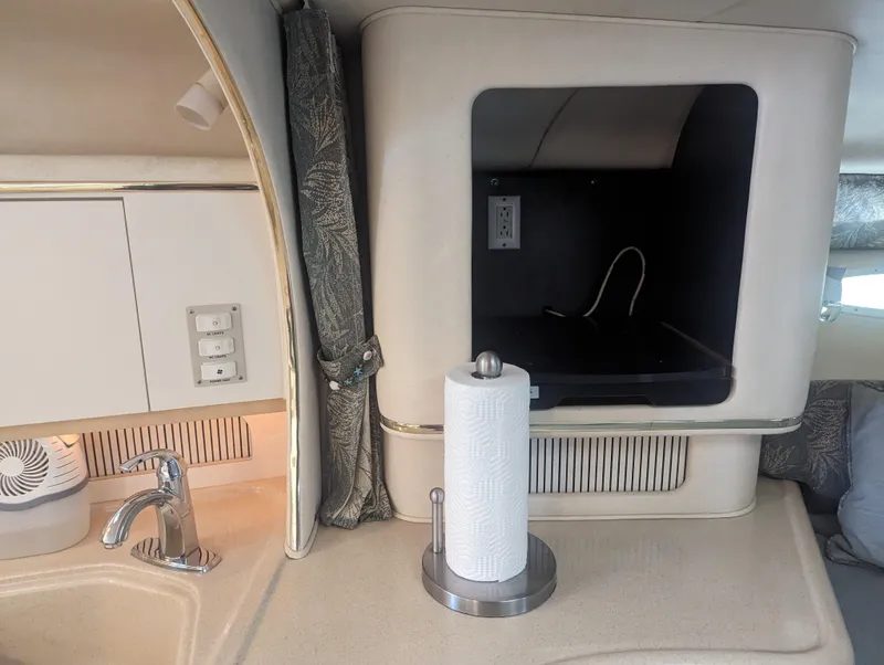 Slide: The Image of Interior of 2000 Sea Ray 310 Sundancer with sink and paper towel holder. - 9