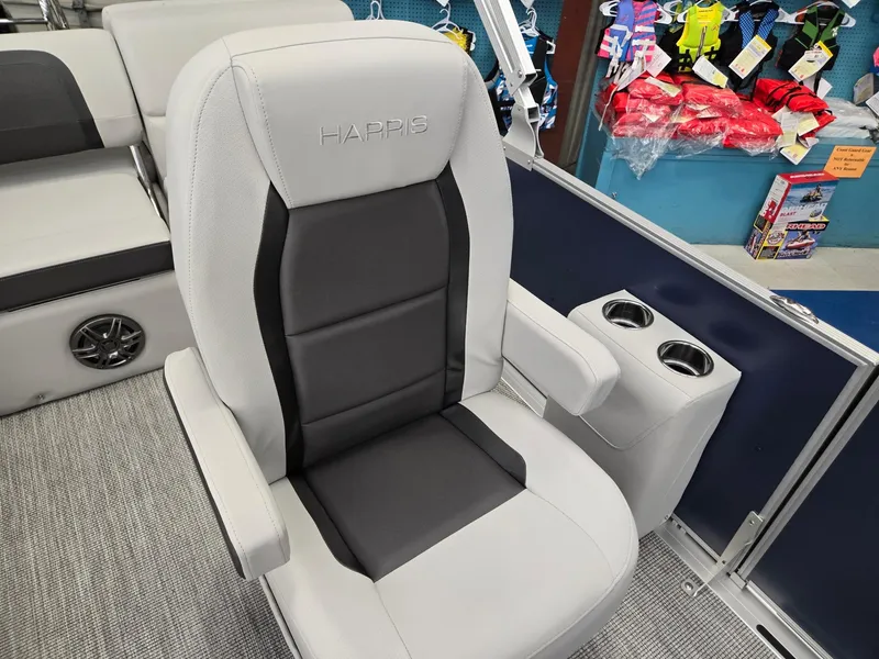 Slide: The Image of 2025 Harris Cruiser 210 boat seat with cup holders, gray and black upholstery. - 12