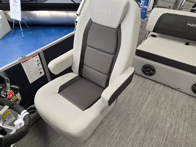Slide: The Image of 2025 Harris Cruiser 210 boat seat, gray and black upholstery, modern design. - 13