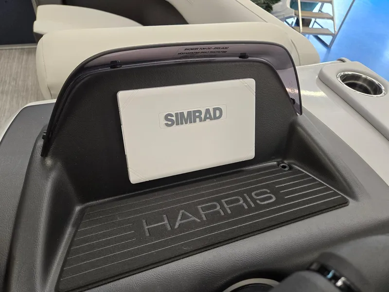 Slide: The Image of 2025 Harris Cruiser 210 dashboard with Simrad navigation system. - 15