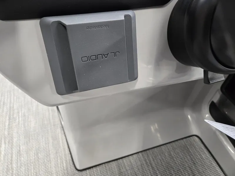 Slide: The Image of JL Audio speaker on 2025 Harris Cruiser 210 boat interior. - 16