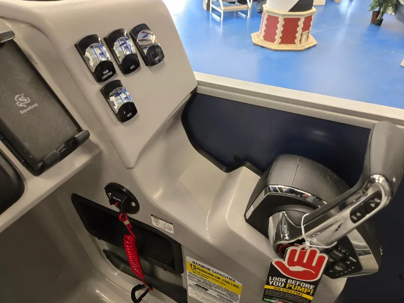 Slide: The Image of Control panel of 2025 Harris Cruiser 210 boat with switches and throttle lever. - 19